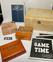 Group display of cigar boxes, plaques, and large chest