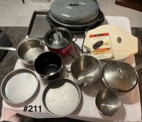 Group shot of all cookware and appliances in lot