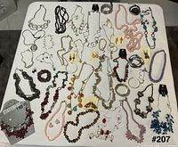 Full layout of all necklaces, bracelets and earrings on tabletop