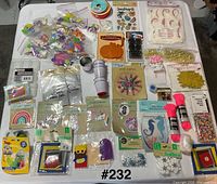 Overview of all packaged craft items laid out on table