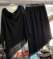 Full view of top and skirt hanging