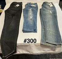 overview showing all three pairs of jeans laid out