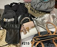 Group shot showing variety of handbags in lot