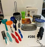 Overview of all kitchen items and accessories spread on table