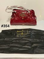 Handbag front view with dust cover