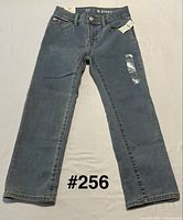 Front view of Gap kids size 6 straight-leg jeans showing medium wash, tags, and overall condition