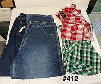Lot overview showing two shirts and two jeans