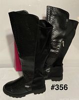 Boots upright showing front and side profiles with faux snakeskin texture and side zipper