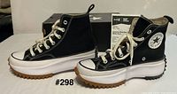 Left side view of both sneakers with box visible