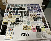 Overview of entire lot laid out on table, shows quantity and variety