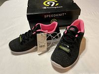Top view of new Champion Speedknit girls sneakers with tags and box