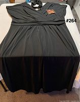 Front view of long black dress laid flat