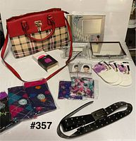 Group shot of handbag, mirrors, earbuds, socks, headwear, shoe inserts, belt