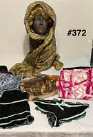 All six scarves displayed together for overview
