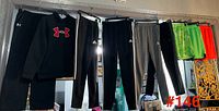 All five clothing items hanging on rod