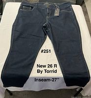 Front view of new Torrid 26R jeans with tag attached, size and inseam text overlay