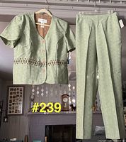 Full view of top on hanger and matching pants hung beside