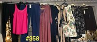 Group shot of all nine garments hanging