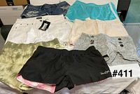 Group shot of all eight pairs of shorts laid out