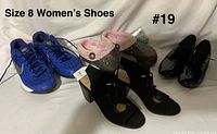 All four pairs of size 8 shoes arranged together