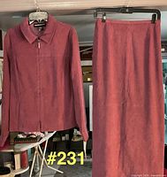 Full view of jacket and skirt hanging