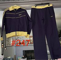Full view of jacket and pants hanging to show complete set and overall colour