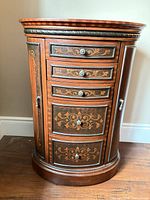Front view closed showing drawers and side doors