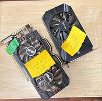 Both graphics cards side by side showing coolers and interface connectors