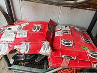 Two red AutoShack boxes containing rotors