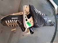 Pair of Bauer Nexus skates showing overall condition and holders