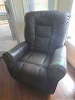 Front view of dark brown power recliner chair