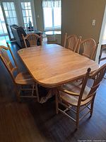 dining table with five chairs around it