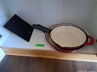Skillets nested together with grill press