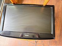 Front view of Haier 22-inch LCD TV showing screen and bezel