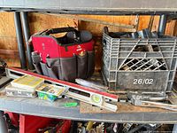 Shelf view showing Husky tote, levels, crate of tools