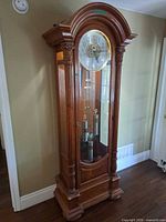 Front view of grandfather clock with door closed