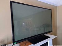 Full view of LG 60-inch plasma TV on stand