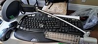 Overall view of keyboard, mouse, lamp and receiver on tabletop