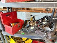 toolbox open with tools, tray, level, soft bag visible
