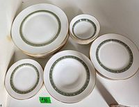 Grouped stacks of dinner, salad, bread plates and small bowls showing pattern and quantity
