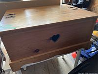 Front view showing heart cutout and lid with hinges
