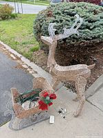 Reindeer and sleigh full view on driveway showing overall design and materials