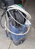 Full view Simoniz blue electric pressure washer with hoses
