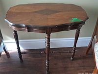 Full view of the antique solid wood side table showing overall design and legs