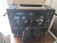 Front view of Sony CRF-320 radio with binoculars positioned in front