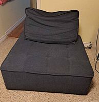 Front view of blue modular sofa seat with backrest upright
