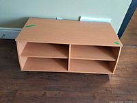 Front angled view showing overall TV stand with shelves and casters