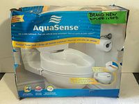 Retail box front showing AquaSense branding, product image, features