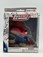 Front of boxed Superman figure showing pose and Justice League branding