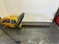 Full view of McCulloch electric hedge trimmer with cord and 18 in blade